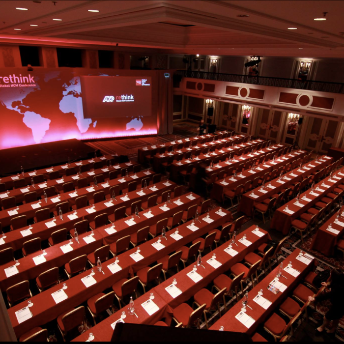 Paris International Conference Gobo lights created wide screen look integrated with projected elements Set